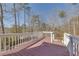 Spacious deck overlooking wooded backyard with stairs at 180 Paces Lakes Pointe St, Dallas, GA 30157