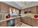 Kitchen with granite countertops and wood cabinets at 180 Paces Lakes Pointe St, Dallas, GA 30157