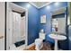 Substantial bathroom with white pedestal sink, toilet and shower/tub combo at 2585 Club Springs Drive, Roswell, GA 30076