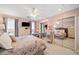 Charming bedroom with mirrored closet doors and floral bedding at 2585 Club Springs Drive, Roswell, GA 30076