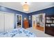 Blue bedroom with access to a full bath and hallway at 2585 Club Springs Dr, Roswell, GA 30076