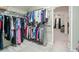 Walk-in closet with custom shelving and ample hanging space at 2585 Club Springs Dr, Roswell, GA 30076