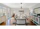 Bright dining room featuring a large table and hardwood floors at 2585 Club Springs Drive, Roswell, GA 30076