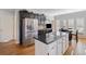 Modern kitchen with stainless steel appliances and large kitchen island at 2585 Club Springs Drive, Roswell, GA 30076