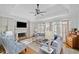 Spacious living room with hardwood floors, fireplace and built-in shelving at 2585 Club Springs Drive, Roswell, GA 30076