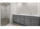 Double vanity bathroom with grey cabinets at 3808 Thatcher Sw Dr, Marietta, GA 30008