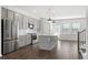 Modern kitchen with gray cabinets, stainless steel appliances, and an island at 3808 Thatcher Sw Dr, Marietta, GA 30008