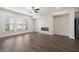 Spacious living room featuring a modern fireplace and hardwood floors at 3808 Thatcher Sw Dr, Marietta, GA 30008