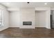 Living area showcasing hardwood floors and a linear fireplace at 3808 Thatcher Sw Dr, Marietta, GA 30008