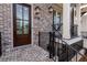 Close-up of a brick townhome entrance, featuring street number 540 and wrought iron railings at 540 Fisher Dr # 46, Alpharetta, GA 30009