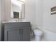 Stylish bathroom with gray vanity, white tile, and bathtub at 550 Fisher Dr # 46, Alpharetta, GA 30009