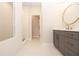 Modern bathroom with herringbone tile shower and gray vanity at 550 Fisher Dr # 46, Alpharetta, GA 30009