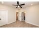 Spacious bedroom with wood-look flooring, ceiling fan, and ample closet space at 550 Fisher Dr # 46, Alpharetta, GA 30009