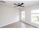 Bright bedroom featuring ceiling fan, wood-look floors and two windows at 550 Fisher Dr # 46, Alpharetta, GA 30009