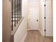 Light hallway with gray wood-look floors and white doors at 550 Fisher Dr # 46, Alpharetta, GA 30009