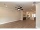 Open concept living room with kitchen and hardwood floors at 540 Fisher Dr # 46, Alpharetta, GA 30009