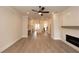 Spacious living room with hardwood floors, fireplace and kitchen view at 550 Fisher Dr # 46, Alpharetta, GA 30009