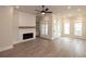 Living room with fireplace, hardwood floors and ceiling fan at 550 Fisher Dr # 46, Alpharetta, GA 30009