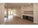 Spacious living room with hardwood floors and built-in shelving at 540 Fisher Dr # 46, Alpharetta, GA 30009