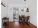 View of the dining area next to the kitchen with stylish lighting, hardwood floors, and furniture at 708 Argonne Ne Ave # 5, Atlanta, GA 30308