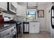 Well-lit kitchen featuring stainless steel appliances, marble countertops, and white cabinetry at 708 Argonne Ne Ave # 5, Atlanta, GA 30308