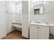 Bathroom features white tile, vanity with drawers, and built-in medicine cabinet at 8554 Taylor Rd, Riverdale, GA 30274