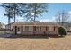 Brick ranch home with a spacious yard at 8554 Taylor Rd, Riverdale, GA 30274