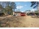 Ranch style brick house with a red wooden deck at 8554 Taylor Rd, Riverdale, GA 30274