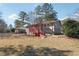 Brick house with red wooden deck and backyard at 8554 Taylor Rd, Riverdale, GA 30274