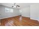 Hardwood floors and ceiling fan in living room at 8554 Taylor Rd, Riverdale, GA 30274