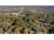 Aerial view showing wooded area and nearby road at 200 Mcguirts Bridge Rd, Covington, GA 30014