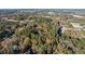 Aerial view showcasing large wooded lot near commercial areas at 200 Mcguirts Bridge Rd, Covington, GA 30014