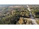 Aerial view of property showing wooded area and nearby road at 200 Mcguirts Bridge Rd, Covington, GA 30014