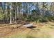 Striped hammock in a shady backyard with trees and leaves at 200 Mcguirts Bridge Rd, Covington, GA 30014