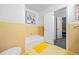 Simple bathroom with yellow tile and bathtub at 200 Mcguirts Bridge Rd, Covington, GA 30014