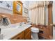 Retro bathroom with light brown tile and a shower/tub combo at 200 Mcguirts Bridge Rd, Covington, GA 30014