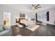 Main bedroom with luxury vinyl plank flooring, modern furniture, and natural light at 200 Mcguirts Bridge Rd, Covington, GA 30014