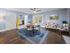 Bright dining area with hardwood floors and a mid-century modern table set at 200 Mcguirts Bridge Rd, Covington, GA 30014