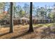 Brick ranch house nestled amongst tall trees at 200 Mcguirts Bridge Rd, Covington, GA 30014