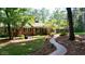 Brick ranch house with landscaped yard and winding brick pathway at 200 Mcguirts Bridge Rd, Covington, GA 30014