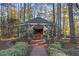 Backyard gazebo with brick base, white pillars and roofing at 200 Mcguirts Bridge Rd, Covington, GA 30014