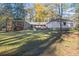 Ranch house with a large backyard and mature trees at 200 Mcguirts Bridge Rd, Covington, GA 30014