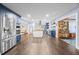 Spacious kitchen featuring stainless steel appliances, blue cabinetry, and dark hardwood floors at 200 Mcguirts Bridge Rd, Covington, GA 30014