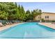 Refreshing community pool with lounge chairs at 2955 Seven Pines Ln # 203, Atlanta, GA 30339