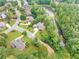 Aerial view of house and community, including a pond at 3327 High Noontide Way, Acworth, GA 30101