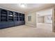 Basement room with built-in shelving and storage at 3327 High Noontide Way, Acworth, GA 30101