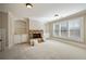 Finished basement room featuring a stone fireplace and built-in shelving at 3327 High Noontide Way, Acworth, GA 30101