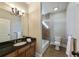 Full bathroom with tub/shower combo and dark vanity at 3327 High Noontide Way, Acworth, GA 30101