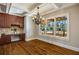 Bright dining room with hardwood floors, chandelier, and view of the pool at 3327 High Noontide Way, Acworth, GA 30101