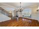 Formal dining room with hardwood floors, chandelier, and wainscoting at 3327 High Noontide Way, Acworth, GA 30101